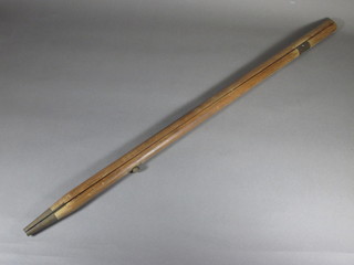 A RSN's mahogany and brass pace stick