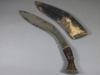 A Kukri, the blade marked guaranteed rustless 12", complete with scabbard