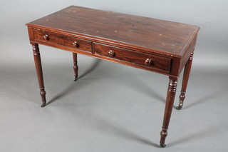 A 19th Century rectangular mahogany side table fitted 2 drawers  raised on turned supports ending in brass caps and castors 45"w x  29 1/2"h x 22"d