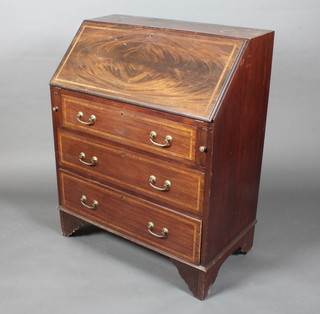 An inlaid mahogany bureau, the fall front revealing a well fitted interior above 3 long drawers 30"w x 37 1/2"h x 17 1/2"d