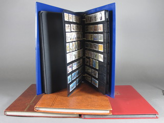 A blue loose leaf album of British stamps, 2 brown stock books  and a red stock book