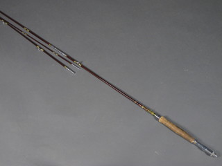 A Kiraku 3 section fishing rod with 2 spare tips
