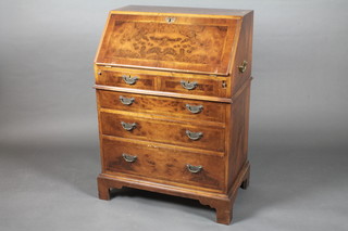 A Queen Anne style walnut bureau, the fall front revealing a well fitted interior above 2 short and 3 long graduated drawers, raised  on bracket feet 26 1/2"w x 38"h x 17"d