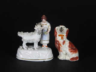 A Staffordshire figure of a seated Spaniel 3 1/2" and a  Continental porcelain group standing girl with goat 4"