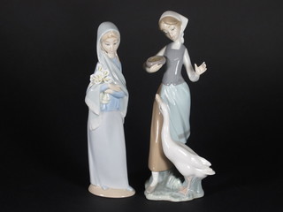 A Lladro figure of a lady with lilies 9" and 1 other Lladro figure of lady with goose 9"