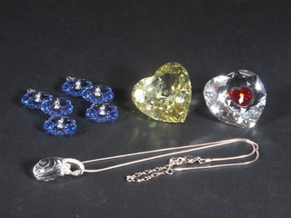 A Swarovski pendant in the form of a coiled snake, 2 Swarovski earrings/floral pendants, a heart shaped pendant and 1 other heart  shaped item marked 2004