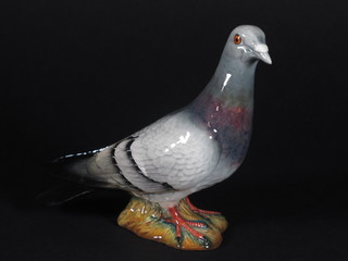 A Beswick figure of a seated pigeon 6", the base marked 1383
