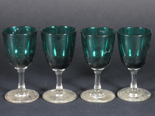 4 green glass wine glasses with clear glass stems