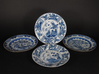 A pair of Oriental blue and white plates with floral decoration,  the reverse with cipher mark 9" and a pair of Oriental blue and  white plates decorated bridge with figures 9"