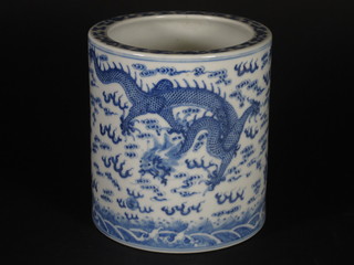 An Oriental blue and white cylindrical vase decorated a dragon  the base with seal mark 5 1/2"