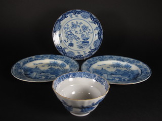 An Oriental plate 9", an Oriental style bowl with wavy border  decorated pagodas 6", 2 Oriental blue and white plates with  transfer decoration 10"