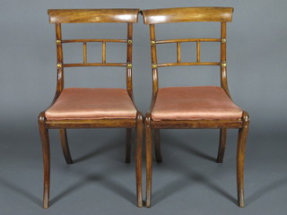 A set of 6 19th Century mahogany bar back dining chairs with  shaped mid rails and woven cane seats, raised on sabre supports