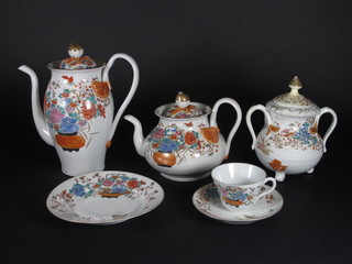 A 50 piece Oriental tea service comprising teapot, coffee pot, cream jug - slight chip to spout, sucrier, 11 plates 7", 12 saucers  - 1 chipped, 10 cups - 3 cracked and 1 chipped, with 6 character  mark to base