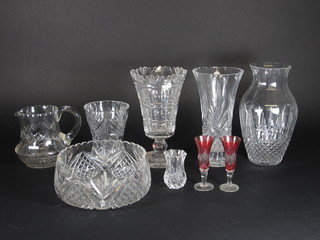 A quantity of various cut glass flower vases, a cut glass decanter and various glassware