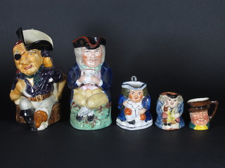 An 18th/19th Century Staffordshire Toby jug 9", a Royal Crown  Devon Toby jug and 3 others