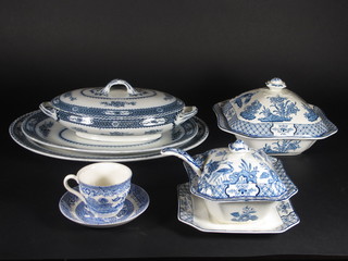 A 50 piece Yuan pattern dinner service comprising 6 oval graduated meat platters 11" - 16", 2 square tureens 9 1/2", 2  sauce ladles, 2 sauce tureens 6 1/2" - 1 stand crazed, 1 tureen  cracked, 11 dinner plates 10" - 1 slight chip to rim, 12 side plates  9", 13 tea plates 8",a Woods 7 piece Warwick pattern dinner  service with 16" oval meat plate, 14" meat plate, 2 oval tureens  and covers 11" - 1 cracked to base, a sauce tureen 8" and 2  dinner plates 10" and a collection of blue and white Willow  pattern teaware