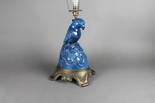 A blue glazed pottery table lamp raised on a gilt metal base 15"