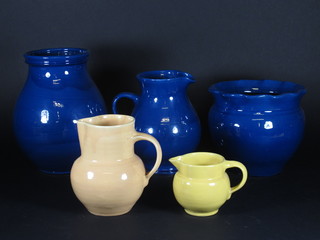 A Brannam blue glazed vase 10", do. jug 7 1/2", do. jardiniere  7" and 2 yellow Brannam jugs 6 1/2" and 3"