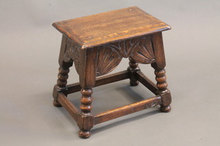 A carved oak joyned stool, raised on turned supports 15"w x  15"h x 11"d