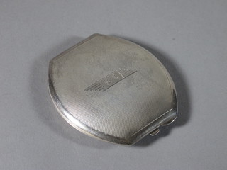 An Art Deco silver compact with engine turned decoration Birmingham 1934