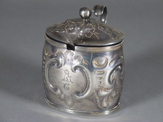 A Georgian oval embossed silver mustard pot, London 1799  complete with blue glass liner and a Georgian silver mustard  spoon 3 1/2 ozs