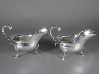 A pair of silver sauce boats with wavy borders and C scroll  handles, London 1938, 7 1/2 ozs ?