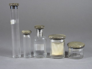 5 Victorian oval glass dressing table bottles with silver banding  and snakeskin enamelled tops, London 1870