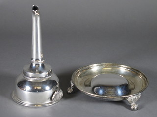 A silver plated wine funnel and stand