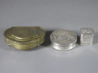 A Continental embossed white metal box with hinged lid, a  sterling circular box with hinged lid 2" and a Continental brass  tobacco box 3"