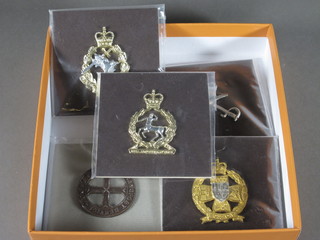 An Inns of Court City Yeomanry cap badge, a Training Corps  cap badge, a Royal Army Dental Corps cap badge, a Fanny's cap  badge and a Royal Army Vetinary Corps cap badge