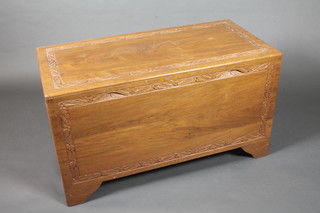 A carved camphor coffer with hinged lid 40"w x 22"h x 20"d