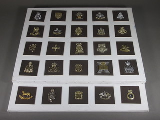 3 canvas panels containing 40 cap badges, mostly O.T.C