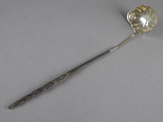 A 18th Century embossed white metal ladle with whale bone  twist handle