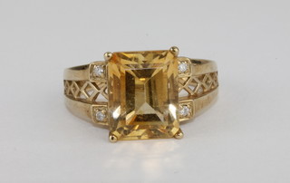 A 9ct gold dress ring set a rectangular yellow cut stone