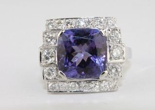 A lady's 18ct white gold dress ring set a rectangular cut tanzanite  approx 5ct surrounded by diamonds approx 1ct