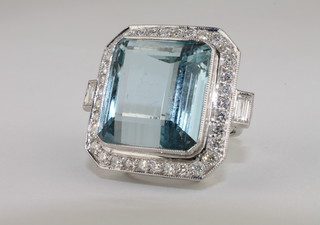 A lady's 18ct white gold dress ring set a large square cut  aquamarine approx 23ct surrounded by diamonds approx 1.25ct   ILLUSTRATED