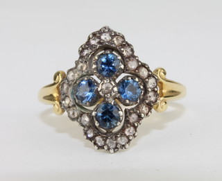 A lady's 18ct yellow gold dress ring set 3 sapphires supported by diamonds