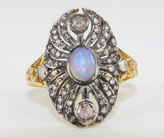 A lady's 18ct yellow gold oval shaped dress ring set opals and diamonds