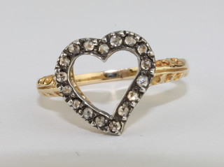 A lady's 18ct gold dress ring in the form of a heart set diamonds