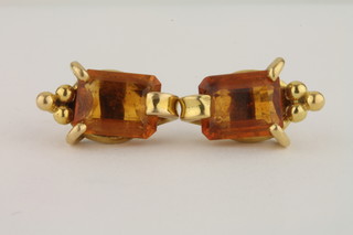 A pair of gold ear studs set Topaz