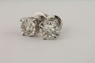 A pair of diamond stud earrings, approx 1.36ct