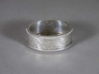 An engraved silver bangle
