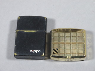 A Zippo lighter and a gold plated Colibri lighter