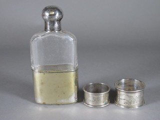 A glass hip flask with silver lid, London 1902 and 2 silver napkin rings