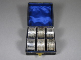 A set of 6 engraved silver napkin rings, Birmingham 1906 4 ozs, cased