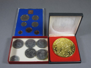 A set of 1977 British proof coins, a Franklin Mint 1983 calendar medallion, various crowns