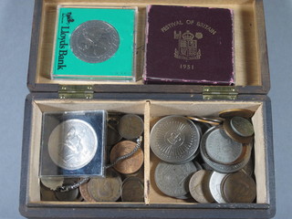A box containing a collection of various coins
