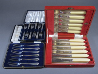 A set of 6 silver plated fish knives and forks, a set of 6 silver  plated pastry forks and 2 sets of 6 silver plated pastry forks,  cased
