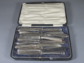 A set of 6 silver handled tea knives together with 8 various silver  handled tea knives, cased