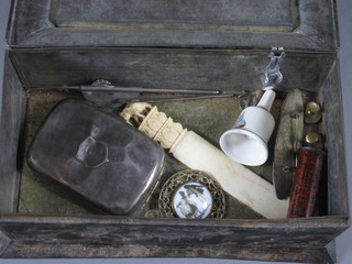 A William Crawford caddy shaped biscuit tin containing a silver cheroot case, ivory paper knife etc